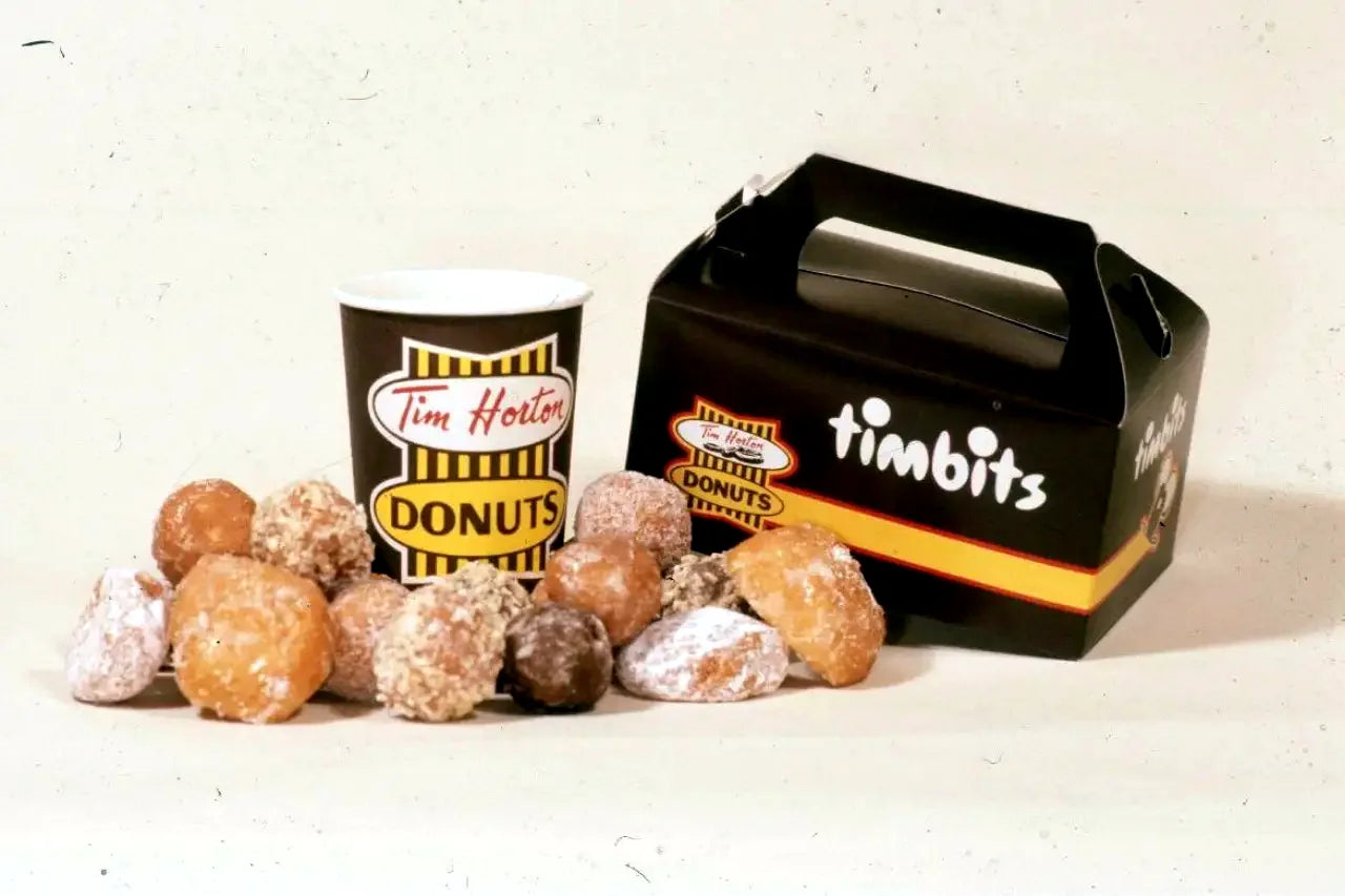 Vintage Timbits box, donut cup, and Timbits on a table