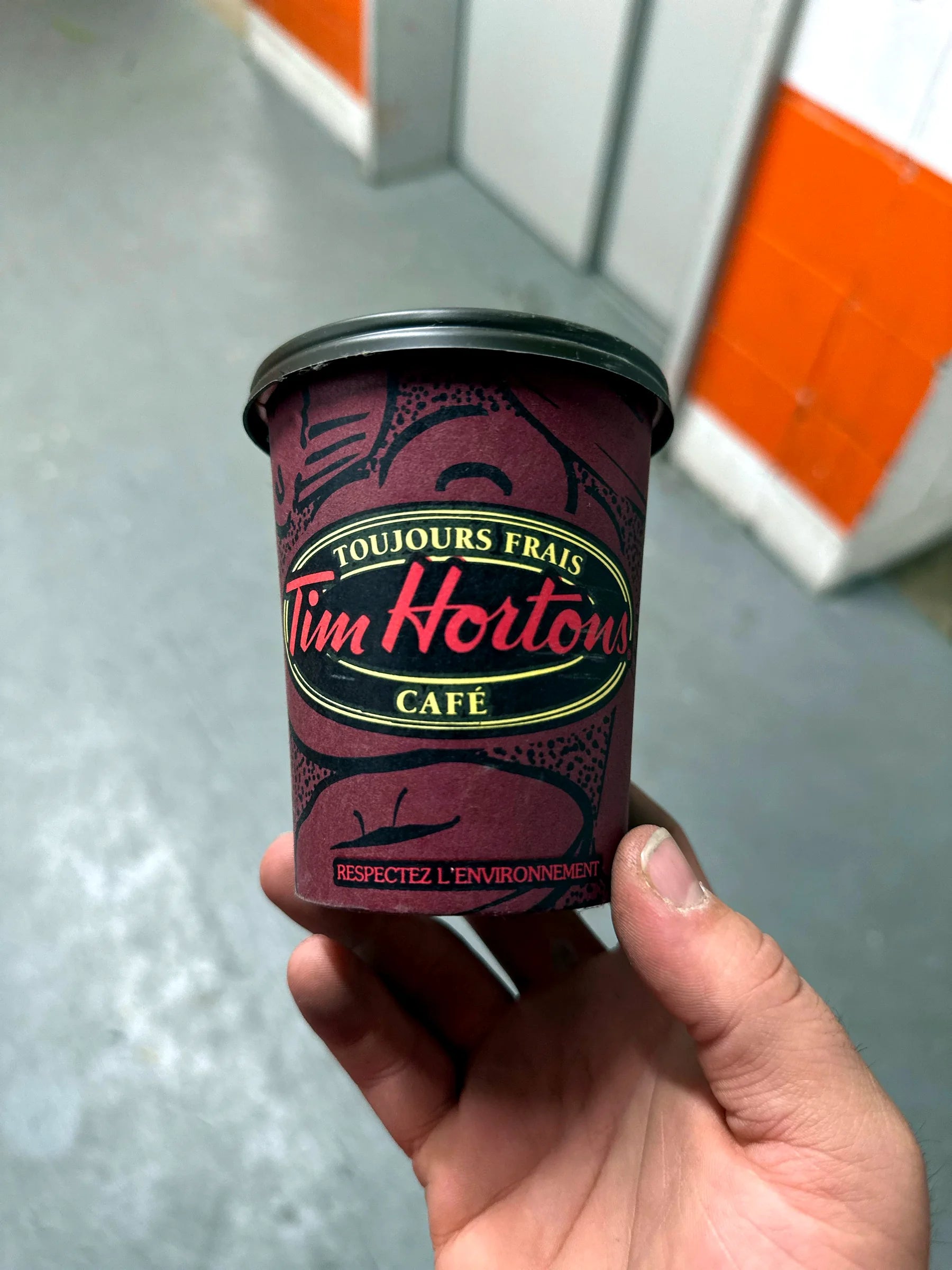 Tim Hortons cafe cup with French text on the label